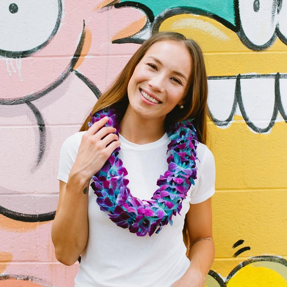 Woman is wearing Double Orchid Lei 