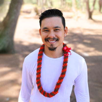 Traditional orange cigar lei made into a spiral shaped design