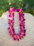 Single strand dyed orchid lei in vibrant color options 
