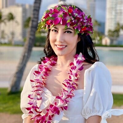 Orchid Haku lei paired with a single orchid lei