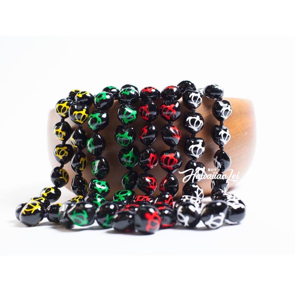 Kukui nut lei featuring hand-painted decorative designs