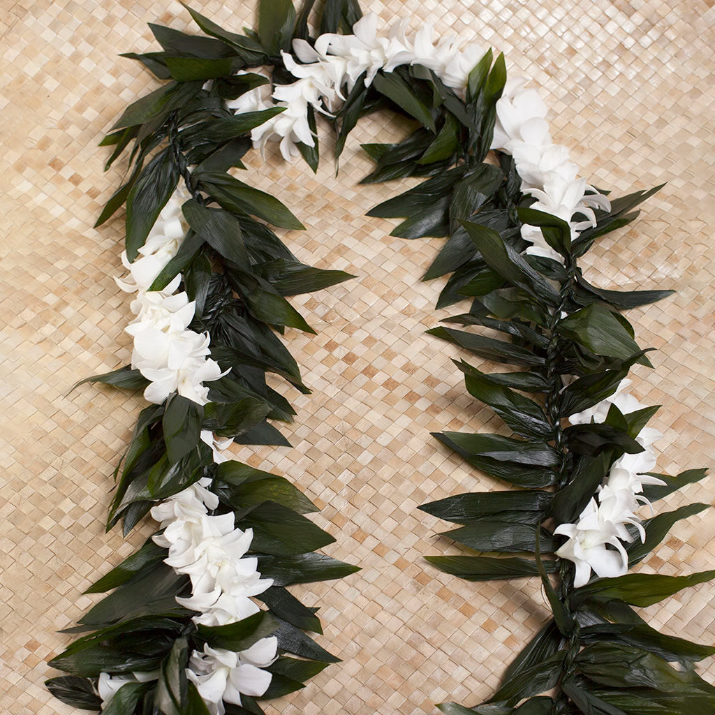 Maile style ti leaf lei wrapped with beautiful orchid strands