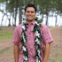 Maile style ti leaf lei wrapped with flowing orchid strands