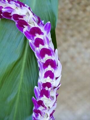 Purple Fancy pikki-style lei with layered blossoms