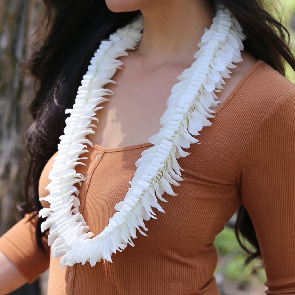 White fancy dendrobium orchid butterfly-style lei with a layered pattern resembling butterfly wings