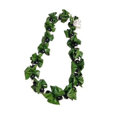 Kukui nut lei combined with green ti leaf accents